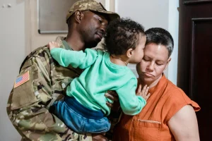 Image of a family as father is being deployed. We buy military members houses fast for cash.